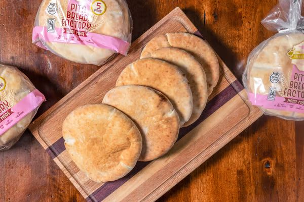 Fresh handmade pita bread on a cutting board